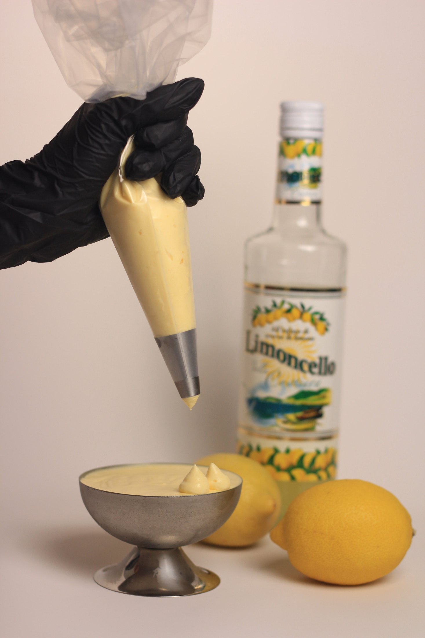 A coupe dessert being finished by hand